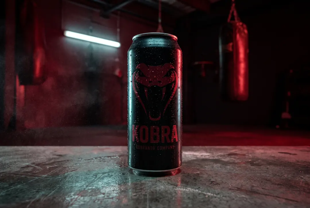 Energy drink can in a gritty night boxing gym