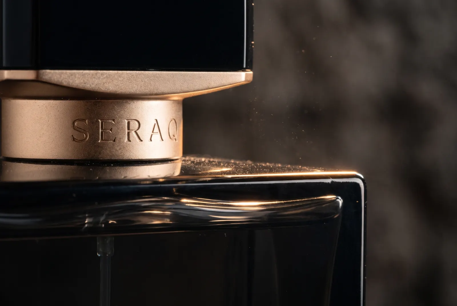 Macro of a black and gold perfume cap