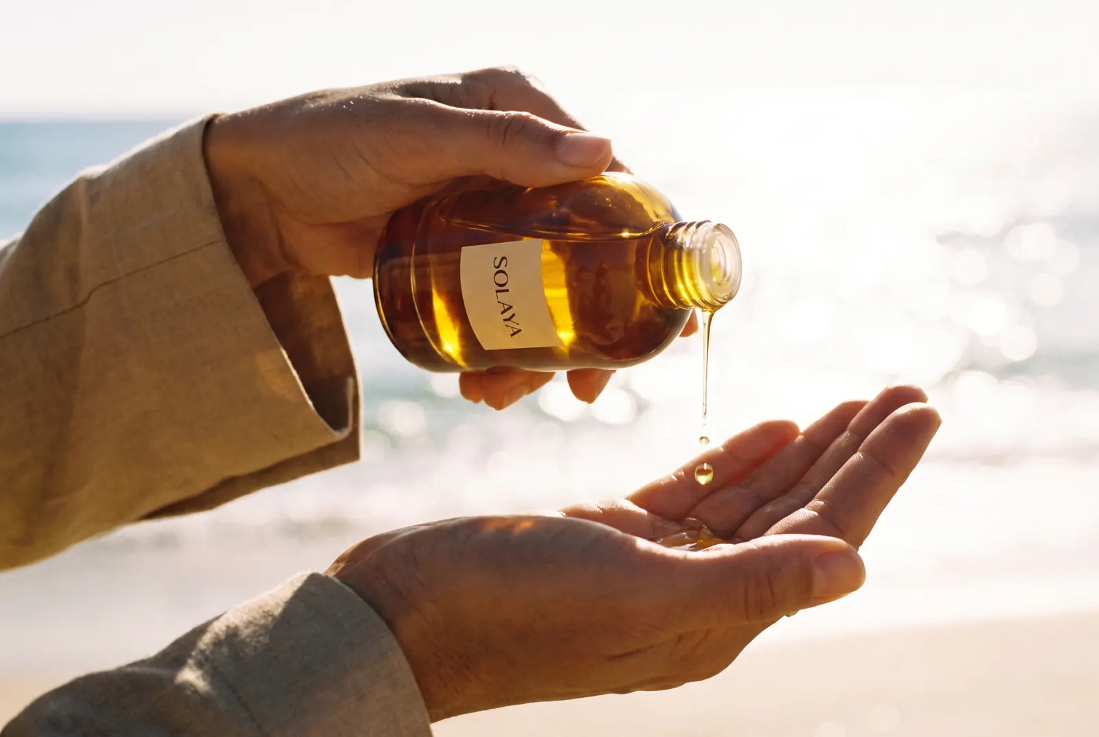 Golden oil poured into an open palm